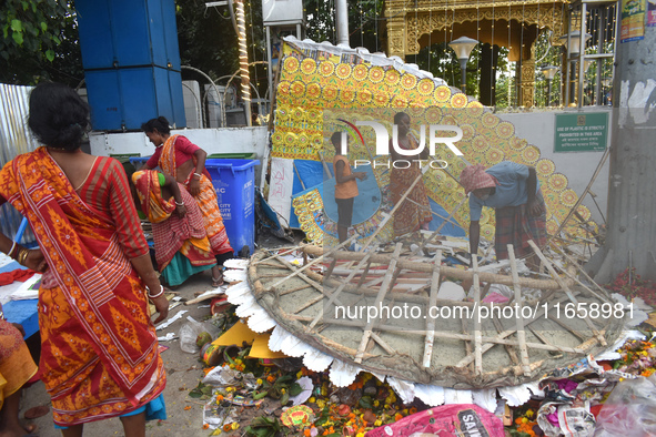 KMC workers clean the banks of the Ganges River on the last day of the Durga Puja festival in Kolkata, India, on October 12, 2024. 