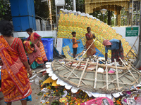 KMC workers clean the banks of the Ganges River on the last day of the Durga Puja festival in Kolkata, India, on October 12, 2024. (