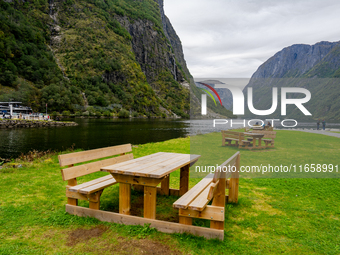 Wooden picnic benches in Gudvangen, Norway, on September 17, 2024. The village of Gudvangen is a popular tourist destination and is located...