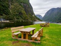 Wooden picnic benches in Gudvangen, Norway, on September 17, 2024. The village of Gudvangen is a popular tourist destination and is located...