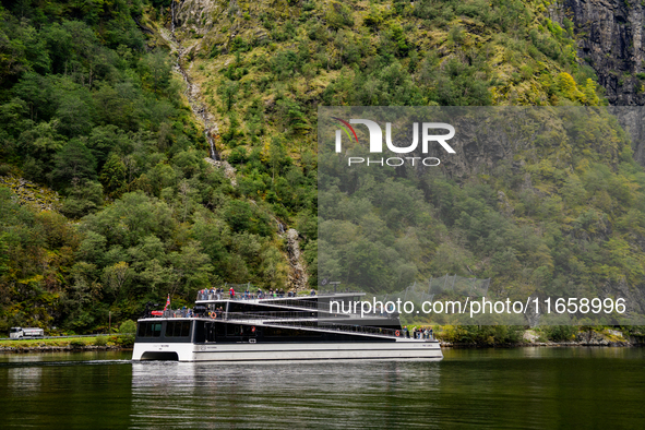 An electric tourist ferry ‘The Fjords’ navigates in the Nærøyfjord, in Gudvangen, Norway, on September 17, 2024. The village of Gudvangen is...