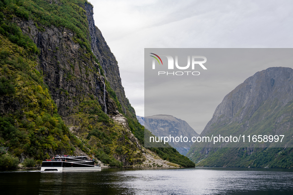 An electric tourist ferry ‘The Fjords’ navigates in the Nærøyfjord, in Gudvangen, Norway, on September 17, 2024. The village of Gudvangen is...