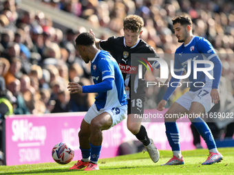 Matt Palmer of Notts County is under pressure from Armando Dobra of Chesterfield and battles with Lewis Gordon of Chesterfield during the Sk...