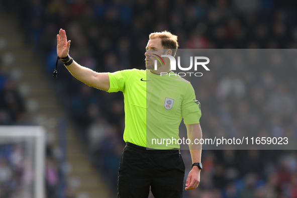 Referee Matthew Corlett gestures during the Sky Bet League 2 match between Chesterfield and Notts County at the SMH Group Stadium in Chester...