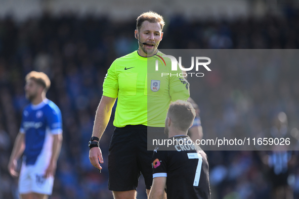 Dan Crowley of Notts County talks with Referee Matthew Corlett during the Sky Bet League 2 match between Chesterfield and Notts County at th...