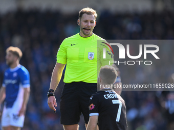 Dan Crowley of Notts County talks with Referee Matthew Corlett during the Sky Bet League 2 match between Chesterfield and Notts County at th...