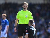 Dan Crowley of Notts County talks with Referee Matthew Corlett during the Sky Bet League 2 match between Chesterfield and Notts County at th...