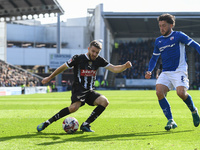 Dan Crowley of Notts County lines up a cross under pressure from Darren Oldaker of Chesterfield during the Sky Bet League 2 match between Ch...