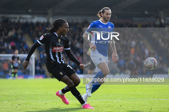 Jevani Brown of Notts County crosses the ball during the Sky Bet League 2 match between Chesterfield and Notts County at the SMH Group Stadi...