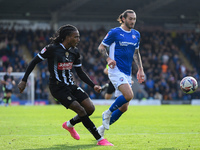 Jevani Brown of Notts County crosses the ball during the Sky Bet League 2 match between Chesterfield and Notts County at the SMH Group Stadi...