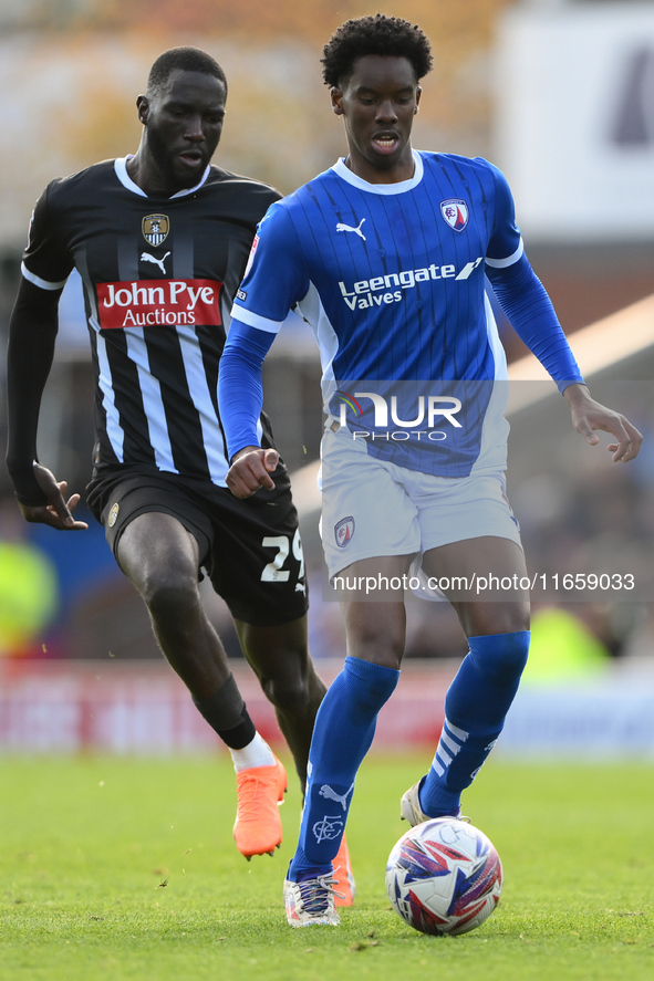 Harvey Araujo of Chesterfield is under pressure from Alassana Jatta of Notts County during the Sky Bet League 2 match between Chesterfield a...