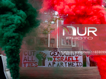 Around two hundred people march along the city center of Nijmegen, Netherlands, on October 12, 2024, to show their support for Palestine and...