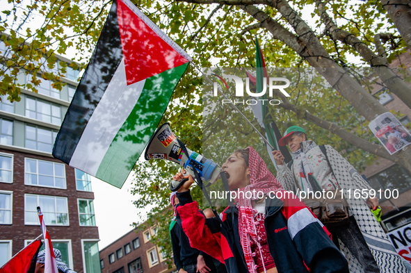 Around two hundred people march along the city center of Nijmegen, Netherlands, on October 12, 2024, to show their support for Palestine and...