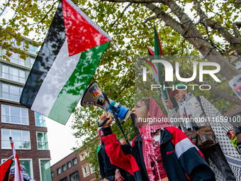 Around two hundred people march along the city center of Nijmegen, Netherlands, on October 12, 2024, to show their support for Palestine and...