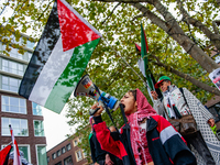 Around two hundred people march along the city center of Nijmegen, Netherlands, on October 12, 2024, to show their support for Palestine and...