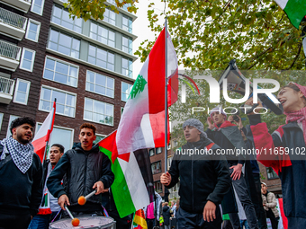 Around two hundred people march along the city center of Nijmegen, Netherlands, on October 12, 2024, to show their support for Palestine and...