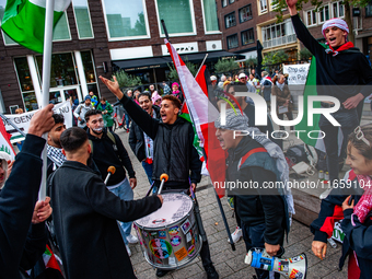 Around two hundred people march along the city center of Nijmegen, Netherlands, on October 12, 2024, to show their support for Palestine and...