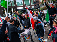 Around two hundred people march along the city center of Nijmegen, Netherlands, on October 12, 2024, to show their support for Palestine and...