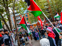 Around two hundred people march along the city center of Nijmegen, Netherlands, on October 12, 2024, to show their support for Palestine and...