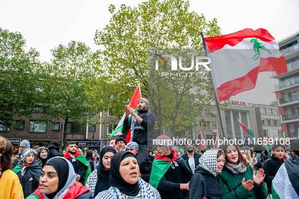 Around two hundred people march along the city center of Nijmegen, Netherlands, on October 12, 2024, to show their support for Palestine and...