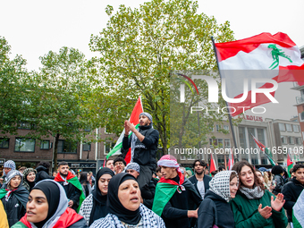 Around two hundred people march along the city center of Nijmegen, Netherlands, on October 12, 2024, to show their support for Palestine and...