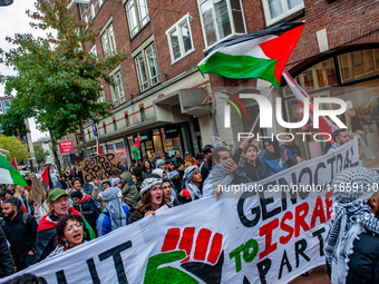 Around two hundred people march along the city center of Nijmegen, Netherlands, on October 12, 2024, to show their support for Palestine and...