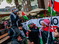 Around two hundred people march along the city center of Nijmegen, Netherlands, on October 12, 2024, to show their support for Palestine and...