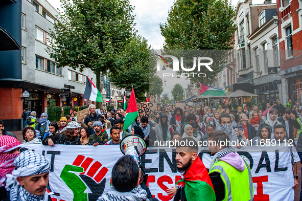 Around two hundred people march along the city center of Nijmegen, Netherlands, on October 12, 2024, to show their support for Palestine and...