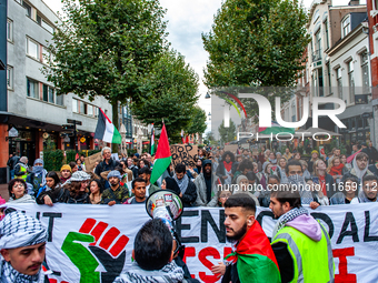 Around two hundred people march along the city center of Nijmegen, Netherlands, on October 12, 2024, to show their support for Palestine and...