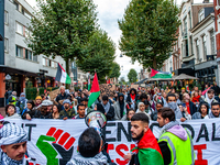 Around two hundred people march along the city center of Nijmegen, Netherlands, on October 12, 2024, to show their support for Palestine and...