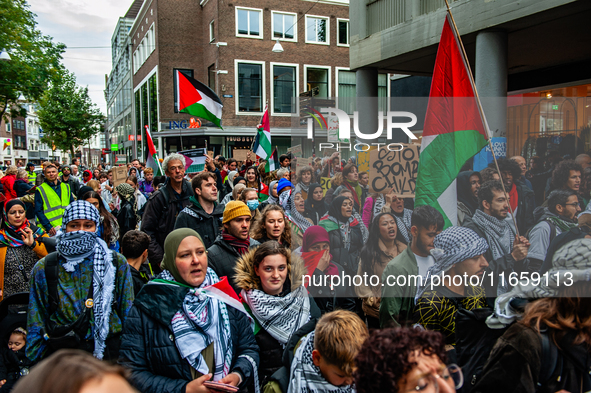 Around two hundred people march along the city center of Nijmegen, Netherlands, on October 12, 2024, to show their support for Palestine and...