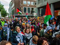 Around two hundred people march along the city center of Nijmegen, Netherlands, on October 12, 2024, to show their support for Palestine and...