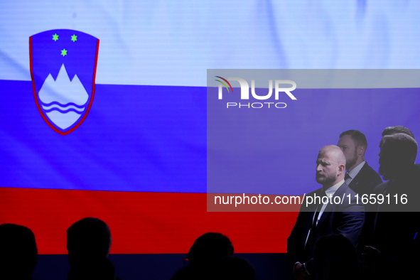 The Slovenia flag is with people during the meeting of the presidents of the Arraiolos group at Wawel Castle in Krakow, Poland, on October 1...