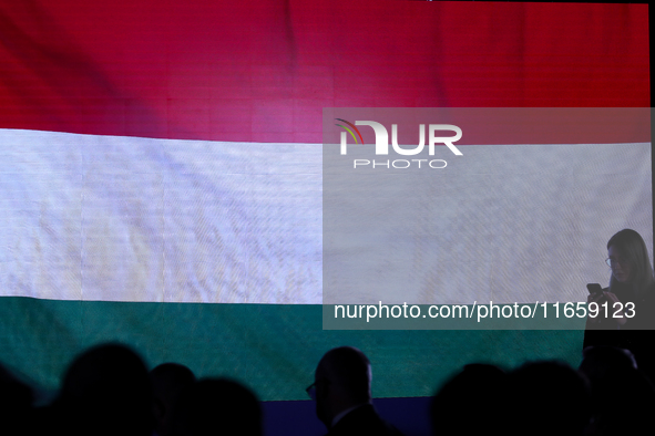 A Hungarian flag is displayed with people during the meeting of the presidents of the Arraiolos group at Wawel Castle in Krakow, Poland, on...