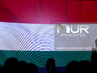 A Hungarian flag is displayed with people during the meeting of the presidents of the Arraiolos group at Wawel Castle in Krakow, Poland, on...