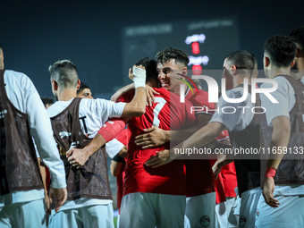 Mahmoud Ahmed of Egypt celebrates with a teammate after scoring the first goal during the Africa Cup of Nations Qualifiers 2025, match numbe...