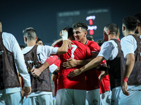 Mahmoud Ahmed of Egypt celebrates with a teammate after scoring the first goal during the Africa Cup of Nations Qualifiers 2025, match numbe...