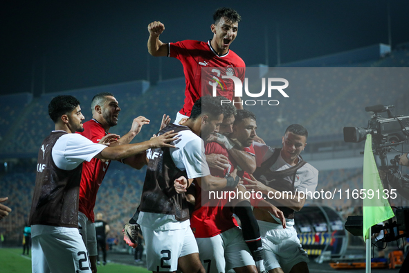 Mahmoud Ahmed of Egypt celebrates with a teammate after scoring the first goal during the Africa Cup of Nations Qualifiers 2025, match numbe...