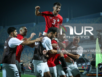 Mahmoud Ahmed of Egypt celebrates with a teammate after scoring the first goal during the Africa Cup of Nations Qualifiers 2025, match numbe...