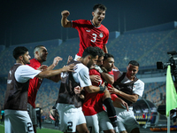 Mahmoud Ahmed of Egypt celebrates with a teammate after scoring the first goal during the Africa Cup of Nations Qualifiers 2025, match numbe...