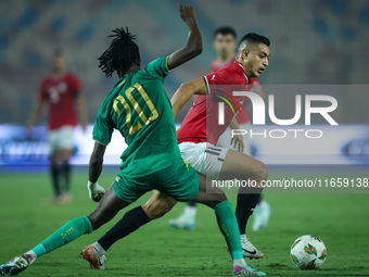 Mostafa Mohamed of Egypt battles for possession with Keita Ibrahima of Mauritania during the Africa Cup of Nations Qualifiers 2025, match nu...