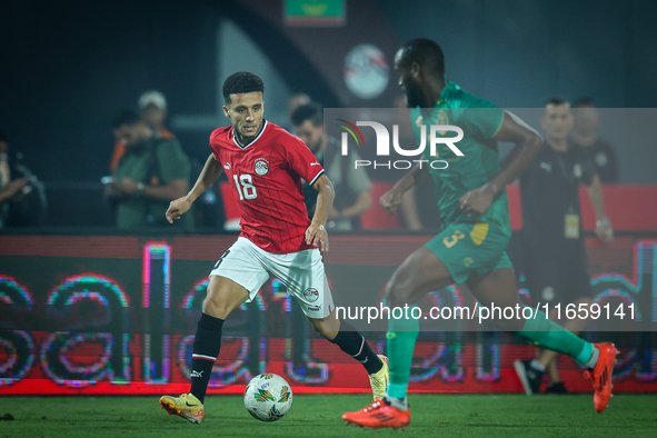 Mostafa Mohamed of Egypt battles for possession with Abeid Aly of Mauritania during Africa Cup of Nations qualifiers 2025, match number 61,...