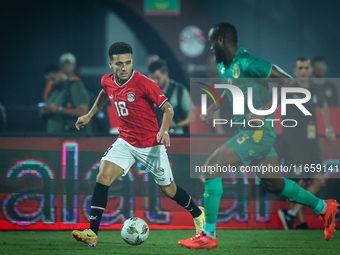 Mostafa Mohamed of Egypt battles for possession with Abeid Aly of Mauritania during Africa Cup of Nations qualifiers 2025, match number 61,...