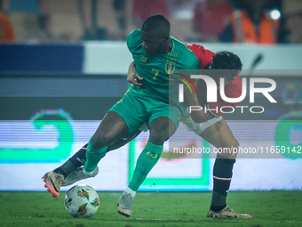 Ahmed Eid of Egypt battles for possession with Aboubakary Koita of Mauritania during the Africa Cup of Nations Qualifiers 2025, match number...