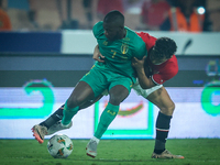 Ahmed Eid of Egypt battles for possession with Aboubakary Koita of Mauritania during the Africa Cup of Nations Qualifiers 2025, match number...