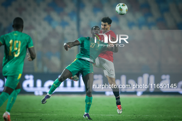 Hamdy Fathy of Egypt battles for possession with Aboubakar Kamara of Mauritania during the Africa Cup of Nations Qualifiers 2025, match numb...