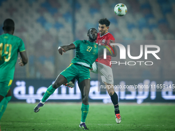 Hamdy Fathy of Egypt battles for possession with Aboubakar Kamara of Mauritania during the Africa Cup of Nations Qualifiers 2025, match numb...