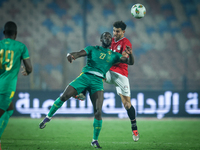 Hamdy Fathy of Egypt battles for possession with Aboubakar Kamara of Mauritania during the Africa Cup of Nations Qualifiers 2025, match numb...