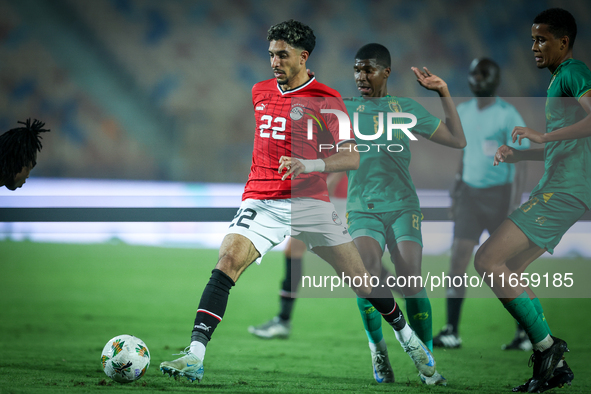 Omar Marmoush of Egypt battles for possession with Mouhsine Bodda of Mauritania during Africa Cup of Nations Qualifiers 2025 match number 61...