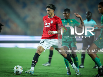 Omar Marmoush of Egypt battles for possession with Mouhsine Bodda of Mauritania during Africa Cup of Nations Qualifiers 2025 match number 61...